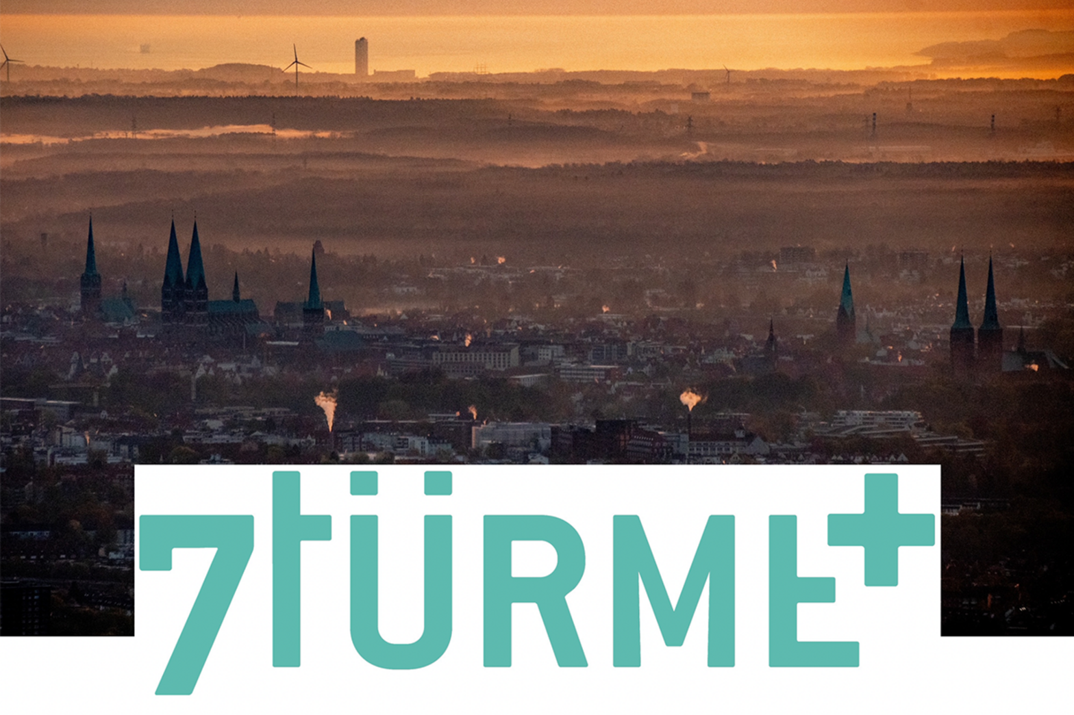 Die sieben Türme aus der Luft plus Schriftzug